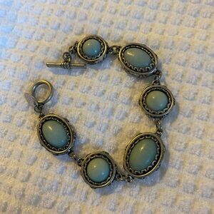 Turquoise color stone bracelet.